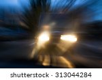 A van approaching in a menacing way in twilight, with deliberate camera shake for the concept of car accident risks