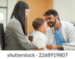 Small photo of A kind doctor who treats pediatric patients. The child and his family brought him to see the doctor at the hospital because he was ill.