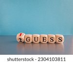Small photo of Turned a dice and changes the expression "2nd guess" to "1st guess", or vice versa. Beautiful gray table blue background. Business and from 2nd guess to 1st guess. Copy space.