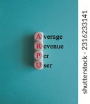 Small photo of ARPU average revenue per user symbol. Concept red words ARPU average revenue per user on wooden cubes on beautiful blue background. Business ARPU average revenue per user concept. Copy space.