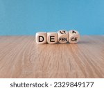 Small photo of Covid-19 delta variant strain defence symbol. Turned the wooden cube and changes the word delta to defence. Beautiful blue background. Covid-19 delta variant strain defence concept. Copy space.