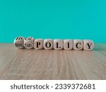 Small photo of Fiscal or monetary policy symbol. Turned cubes and changes words fiscal policy to monetary policy. Beautiful blue background. Business and fiscal or monetary policy concept. Copy space.