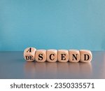 Small photo of Ascend or descend symbol. Concept words Ascend and Descend on wooden cubes. Beautiful grey table blue background. Business ascend or descend concept. Copy space.