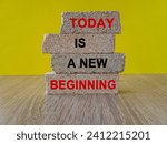 Small photo of Today is a new beginning symbol. Concept words Today is a new beginning on brick blocks. Beautiful wooden table yellow background. Business, today is a new beginning concept. Copy space.