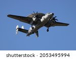 Small photo of Wallops Flight Facility, Virginia, USA - October 1, 2021: E-2D Hawkeye 663 from VAW-120 squadron, normally stationed at NAS Norfolk out at NASA Wallops Flight Facility practicing touch and goes.