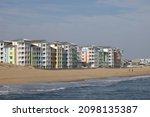 Small photo of Virginia Beach, Virginia, USA - December 28, 2021: Landscape of the beach and some colorful condominiums at Sandbridge in Virginia Beach