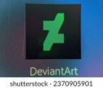 Small photo of Terengganu, Malaysia - 5 October 2023 : Macro of deviantart logo on smartphone display