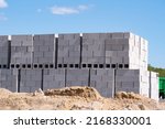 stacks of concrete blocks on pallets at a construction material wearhouse ready for sale concrete blocks are widely used in building construction site
