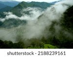 Small photo of Beautiful image of mountain top with monsoon clouds. Due to mist and clouds, distant mountain ranges are little hazy, gives a mystique scene.