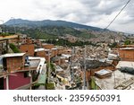 Small photo of Colorful streets of Comuna 13 district in Medellin, Colombia, a former crime ridden neighborhood.