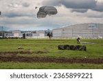 Small photo of Ostrava, Czech Republic - September 17th 2022: Paratrooper parachute landing. Polish special forces JW AGAT tactical HALO paradrop at NATO days airshow at Leos Janacek airport. Soldiers training