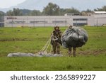 Small photo of Ostrava, Czech Republic - September 17th 2022: Paratrooper parachute landing. Polish special forces JW AGAT tactical HALO paradrop at NATO days airshow at Leos Janacek airport. Soldiers training