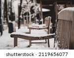 Snow Covered Bench In The Park. ...