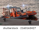 Orange Rescue Boats On The Pier....