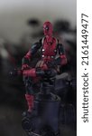 Small photo of Yogyakarta Indonesia - May 22 2022: Deadpool on a tripod with a bokeh background