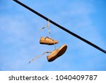 Old Shoes Hanging On Electrical ...