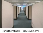 Small photo of cubicles inside office building, place of work