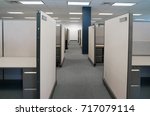 Small photo of cubicles inside office building, place of work