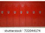 Close up on red lockers in gym