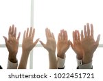 Small photo of Multi-ethnic diverse people hands lifted up in the air, black and white palms raised as volunteering, initiative and engagement concept, business team training, activists get involved, close up view