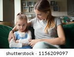Small photo of Loving mother consoling or trying make peace with insulted upset stubborn kid daughter avoiding talk, sad sulky resentful girl pouting ignoring caring mom embracing showing support to offended child
