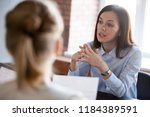 Small photo of Confident focused businesswoman, teacher or mentor coach speaking to business people at negotiations, woman leader speaker applicant talking at meeting or convincing hr during job interview concept