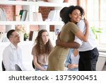 Small photo of Biracial woman psychologist addiction counsellor hug afro guy at group session express support gratitude for honesty, diverse people gather together solve problems abuse struggle, rehab center concept