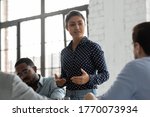 Small photo of Indian businesswoman negotiates with clients showing persuasion skills during formal meeting feels confident. Business coach provide helpful information at workshop. Negotiations, leadership concept