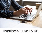 Close up image female hands typing on laptop keyboard. Businesswoman text response to client e-mail, customer buy on-line using web shop services. Internet and modern wireless technology usage concept