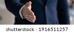 Small photo of Banner panoramic header view of businessman stretch hand for handshake greet get acquainted at meeting in office. Male CEO shake hand welcome newcomer at workplace. Acquaintance concept.