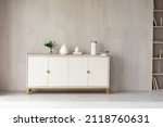 Small photo of White modern dresser minimalistic furniture in empty room on grey wall background, small cupboard with decor, vases and lily of the valley flowers bouquet, cozy apartment house interior concept