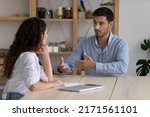 Small photo of Latino male company position candidate answers questions during job interview in office, female recruiter listen to applicant. Staffing, business meeting of client and manager, human resources concept