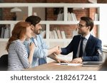 Small photo of Couple handshake mortgage officer worker, accept bank loan terms and rates feel satisfied. Make financial deal, take credit, buying insurance cover, receive professional consult, sign contract concept