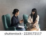 Small photo of Negotiations of two multi ethnic businesswomen in modern office. Indian female applicant pass job interview, answers to HR manager during formal meeting in workspace. Teamwork, business, communication