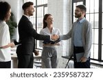 Small photo of Happy male business partners shake hands get acquainted greeting in office, smiling businessmen handshake close deal or make agreement after successful negotiation, partnership concept