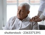Small photo of Supportive female caregiver comfort help upset lonely senior 80s male patient in retirement house, caring woman nurse support unhappy distressed mature man in hospital, elderly healthcare concept