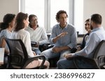 Small photo of Motivated inspired business team employee man talking to colleague, convincing, gesturing, sharing ideas to project staff. Group of addicts meeting for therapy, social support, discussing problems