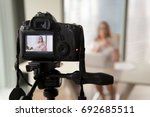Professional digital equipment recording video blog of businesswoman, online business coach making presentation for website, filming popular vlog or master class for videoblog channel, focus on camera