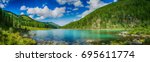 Panoramic view on mountain lake in front of mountain range, national park in Altai republic, Siberia, Russia