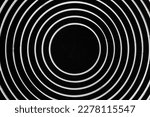 Small photo of Frying pan background. Bottom side of frying pan. Circular pattern. Optical illusion design.