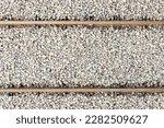 Railway top view background. Train transport industry. Rail track texture. Good and cheap way of transportation for cargo. Old railroad wooden tie. Track ballast gravel made of crushed stone.	