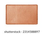 Brown leather belt strap closeup isolated on white. Brown stitched leather seam frame label tag isolated on white. Empty copy space fashion background. Textile frame cutout.