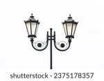 Victorian street light. Street lamp isolated on white. Black paint metal construction. Decorative blacksmith work. Black antique lantern. Small town vintage city lamp cutout.