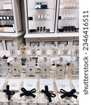Small photo of BANGKOK, THAILAND - July 30 2023: Glass bottles of Jo Malone luxury perfume and paper blotters on a stand. Jo Malone London is a British premium perfume. Vertical