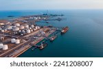Small photo of Oil refinery or petroleum refinery in the industrial factory of heavy industry, oil production plant. Crude oil tanker and Gas tanker container ship, LPG Tank, CNG tank