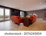 Small photo of Brockley Green, Suffolk, England - January 28 2020: Modern living room lounge with contemorary furniture and exposed timber flooring