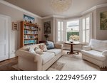 Small photo of Cambridge, England - August 24 2018: Luxury traditional furnished victorian living room with modern furniture bay window