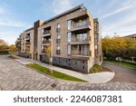 Small photo of Fellows House, Lilywhite Road, Cambridge, England - Nov 8 2018: Modern contemporary apartment building with secure gated under croft parking viewed from highway.
