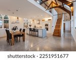 Small photo of Commercial End, Cambridgeshire, England - March 22 2015: Modern chic kitchen within converted chapel with polished concrete floor