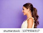 Close-up profile side view portrait of nice adorable well-groomed attractive stunning lovable fascinating magnificent winsome content cheerful cheery wavy-haired girl isolated over violet background